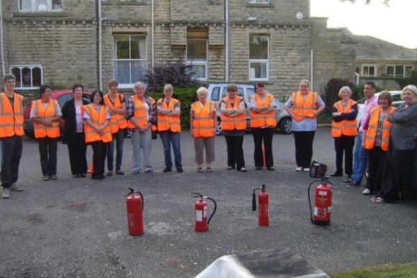 Staff completing fire extinguisher training | fire safety awareness course